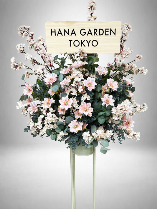 桜をイメージした淡いピンクの花とグリーンを組み合わせたRe:Bloom桜グリーンスタンド花