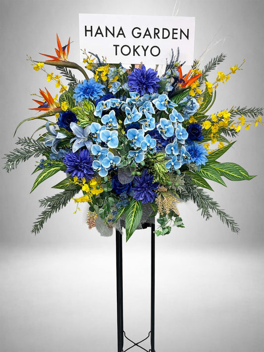 Re:Bloom ブルーエレガンス胡蝶蘭スタンド ブルー胡蝶蘭とカラフルな花々を使用した華やかな祝い花スタンド